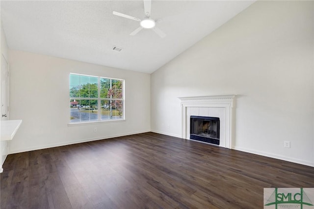 unfurnished living room with a ceiling fan, visible vents, high vaulted ceiling, wood finished floors, and a fireplace