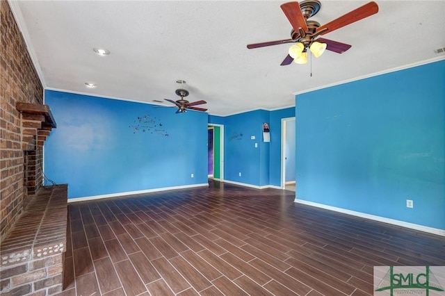 unfurnished living room featuring a ceiling fan, baseboards, a brick fireplace, crown molding, and wood finished floors