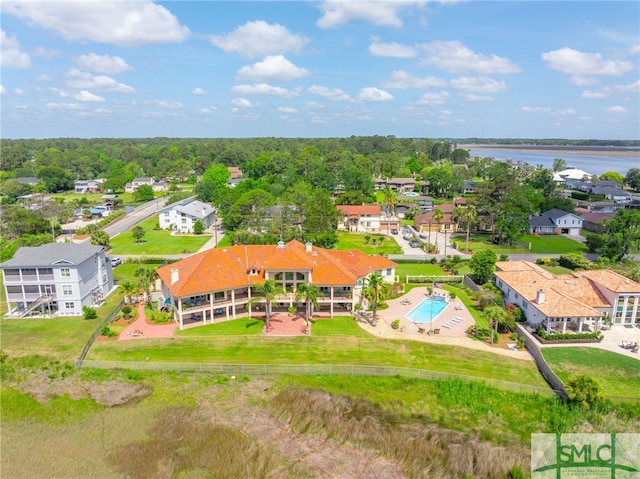 birds eye view of property with a water view and a residential view