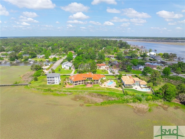 drone / aerial view with a water view and a residential view