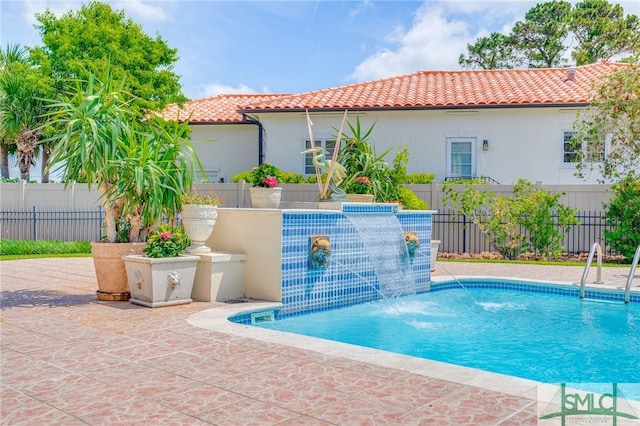 view of pool featuring a fenced in pool and fence