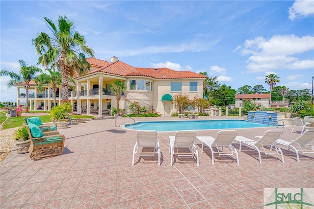 outdoor pool featuring a patio area