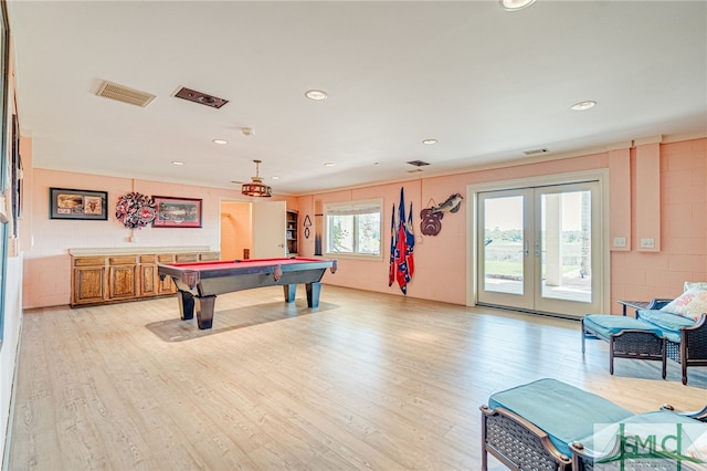 rec room featuring billiards, light wood-style floors, visible vents, and french doors