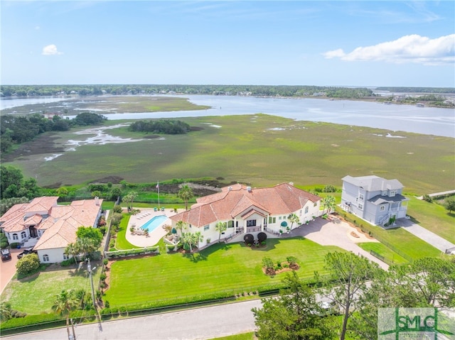 birds eye view of property with a water view