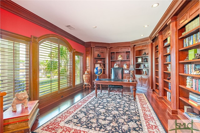 office space with ornamental molding, recessed lighting, visible vents, and wood finished floors