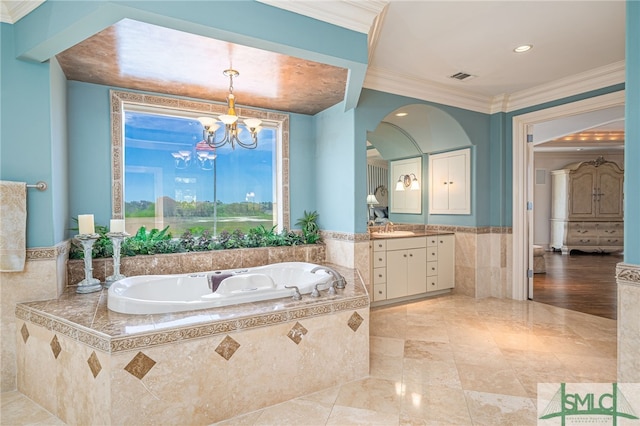 bathroom featuring tile walls, ornamental molding, visible vents, wainscoting, and a garden tub