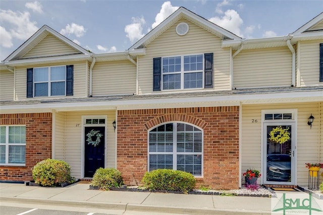 view of front of house with brick siding