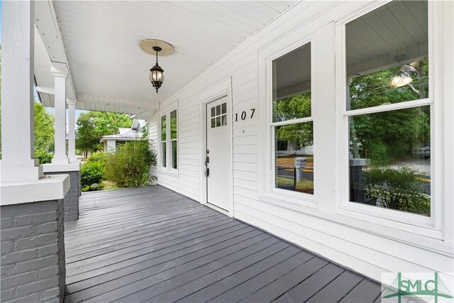 wooden deck featuring a porch