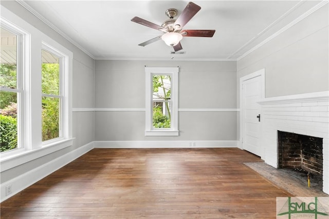 unfurnished living room with hardwood / wood-style floors, a ceiling fan, and ornamental molding