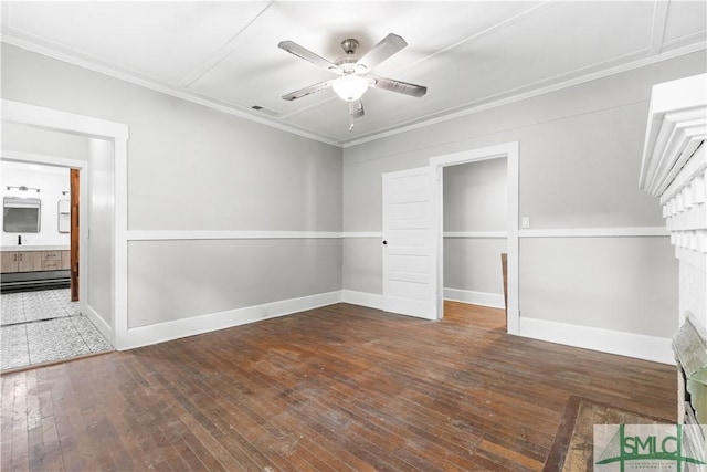 unfurnished bedroom featuring crown molding, visible vents, baseboards, and hardwood / wood-style flooring