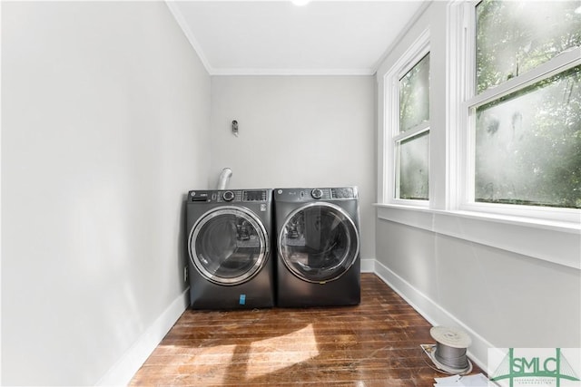 laundry room with washer and dryer, wood finished floors, laundry area, crown molding, and baseboards