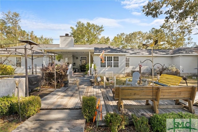 671 M P Martin Rd, Brooklet, GA 30415 - rear view of property featuring a wooden deck and a chimney