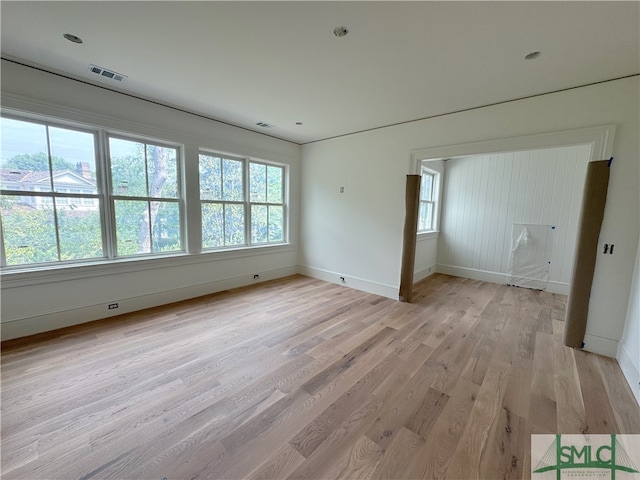 13 Magnolia Ln, Richmond Hill, GA 31324 - empty room with light wood-type flooring, baseboards, visible vents, and plenty of natural light