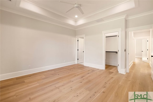 151 Pittman Dr, Rincon, GA 31326 - unfurnished bedroom featuring a ceiling fan, a tray ceiling, light wood-style flooring, baseboards, and crown molding