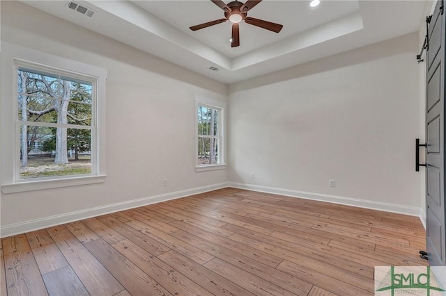 LOT10 Waters Cir, Pembroke, GA 31321 - empty room with a wealth of natural light, visible vents, a ceiling fan, and a raised ceiling