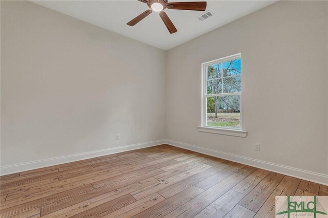 LOT10 Waters Cir, Pembroke, GA 31321 - unfurnished room with visible vents, baseboards, ceiling fan, and hardwood / wood-style flooring