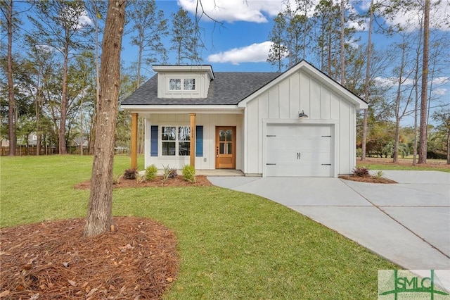 LOT10 Waters Cir, Pembroke, GA 31321 - view of front of house featuring a garage, a front lawn, board and batten siding, roof with shingles, and driveway