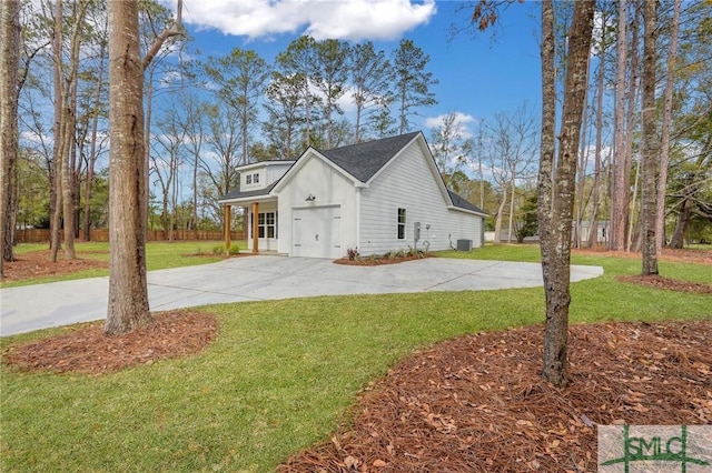 LOT10 Waters Cir, Pembroke, GA 31321 - view of home's exterior with a yard, driveway, a garage, and central AC