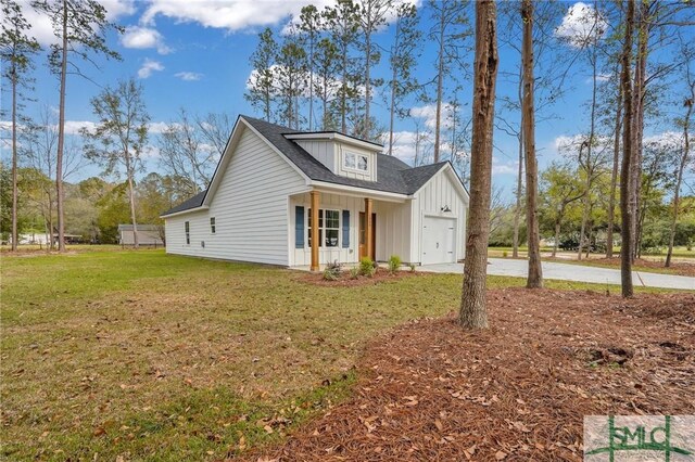 LOT10 Waters Cir, Pembroke, GA 31321 - view of front of home with roof with shingles, concrete driveway, a front lawn, and board and batten siding