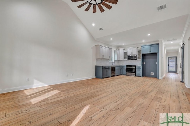 LOT10 Waters Cir, Pembroke, GA 31321 - unfurnished living room featuring visible vents, light wood-style flooring, a ceiling fan, and high vaulted ceiling
