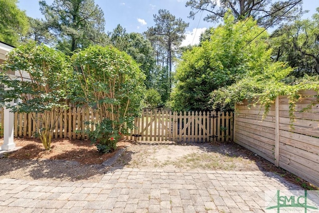 view of gate featuring fence