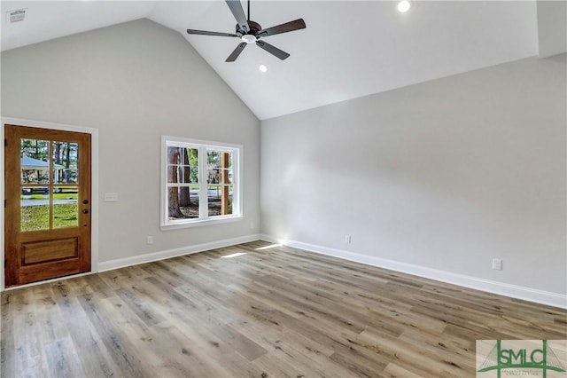 interior space with ceiling fan, visible vents, high vaulted ceiling, and plenty of natural light