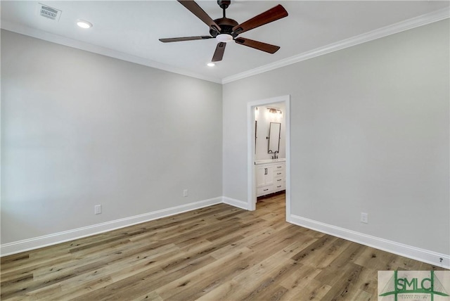 interior space featuring wood finished floors, crown molding, visible vents, baseboards, and recessed lighting