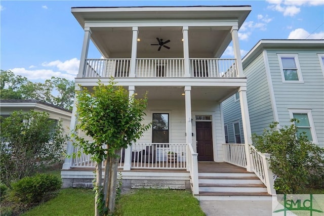 view of front facade featuring a porch, ceiling fan, and a balcony