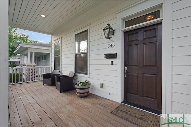 doorway to property with a porch