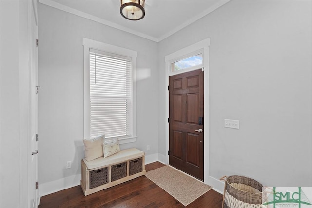 entrance foyer featuring crown molding, baseboards, and dark wood finished floors