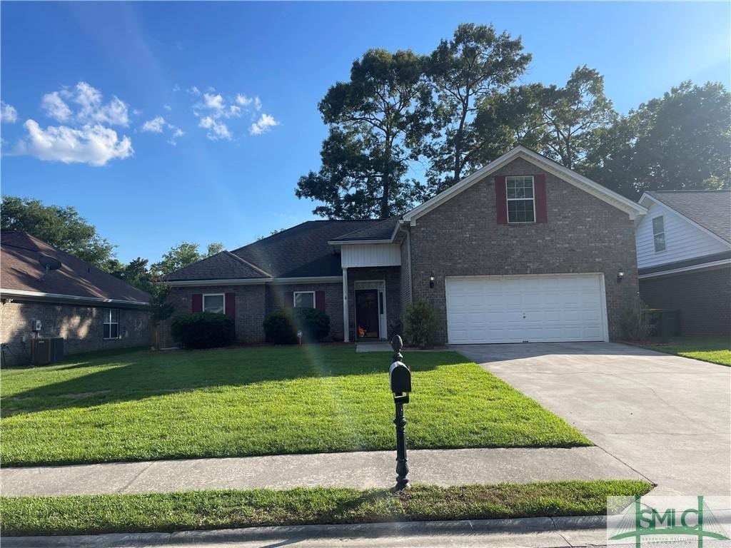 view of front of home with a garage, central air condition unit, a front yard, brick siding, and driveway