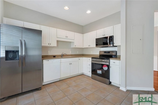 104 Coach House Sq, Pooler, GA 31322 - kitchen featuring light tile patterned flooring, white cabinets, recessed lighting, and appliances with stainless steel finishes