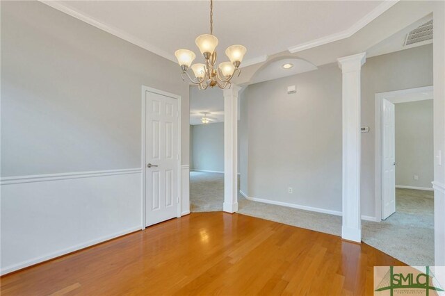 104 Coach House Sq, Pooler, GA 31322 - unfurnished dining area featuring baseboards, visible vents, a chandelier, wood finished floors, and ornate columns