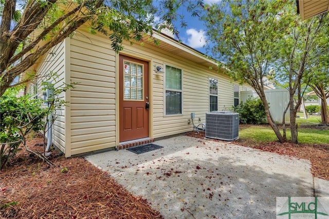104 Coach House Sq, Pooler, GA 31322 - property entrance featuring central air condition unit and a patio
