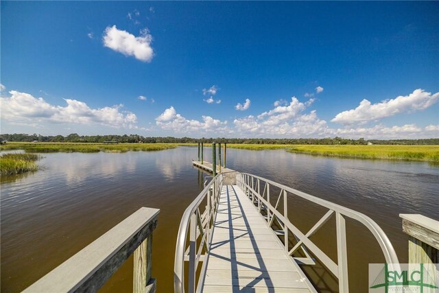 dock area featuring a water view