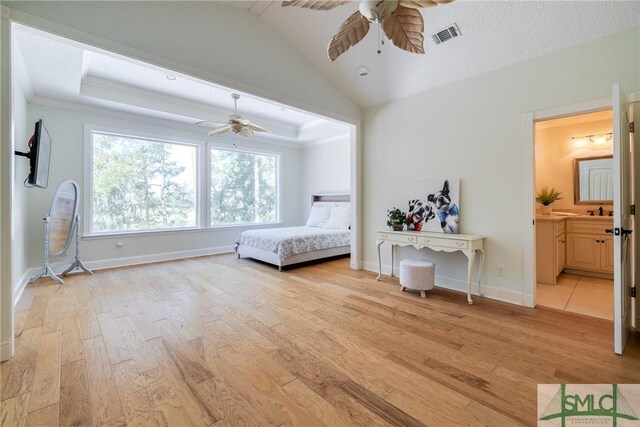 bedroom with baseboards, light wood finished floors, and visible vents
