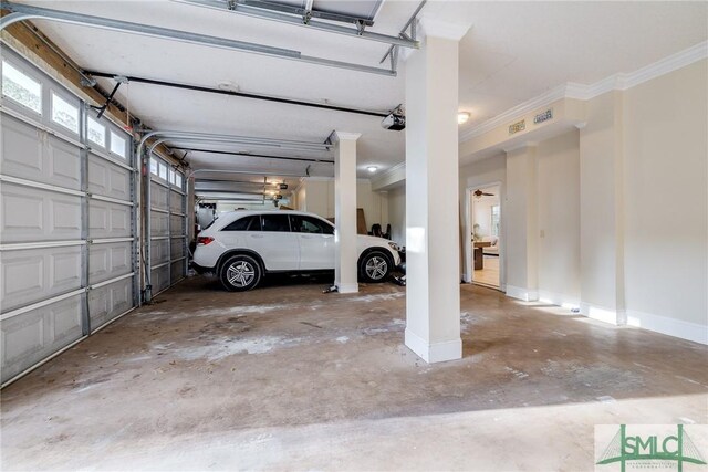 garage with baseboards and a garage door opener