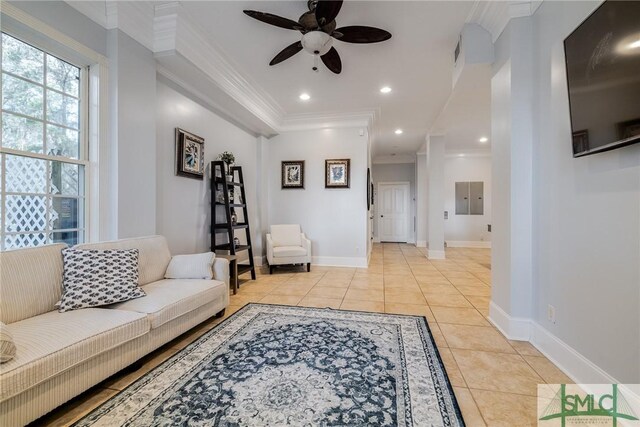 living room featuring crown molding, baseboards, ceiling fan, light tile patterned flooring, and recessed lighting
