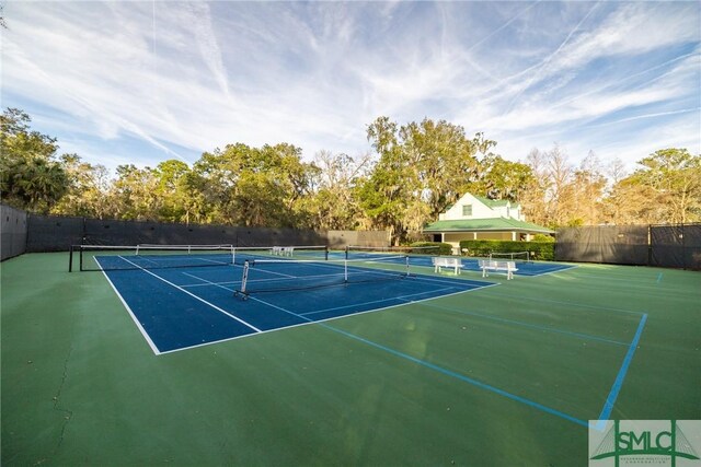 view of tennis court with fence