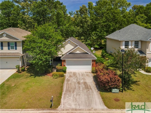 view of front of home with concrete driveway and a front lawn