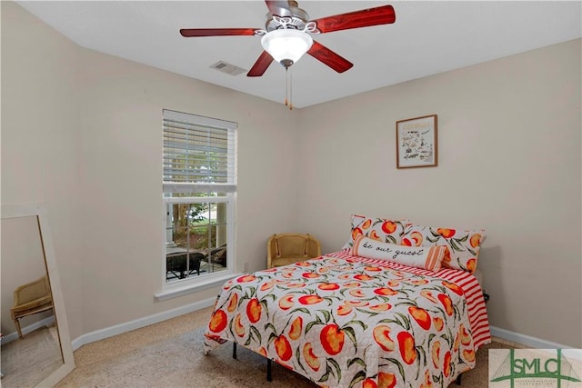 bedroom with baseboards, ceiling fan, visible vents, and carpet floors