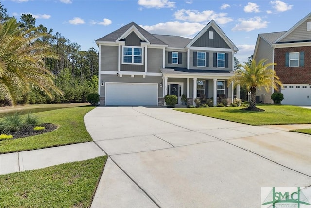 view of front of home featuring a front yard, concrete driveway, a garage, and board and batten siding