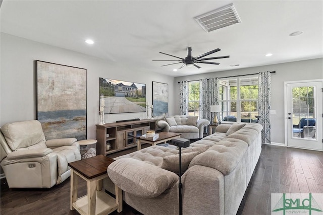 living area with a wealth of natural light, visible vents, and recessed lighting