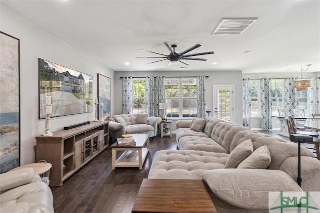 living area with a ceiling fan, recessed lighting, visible vents, and dark wood-type flooring