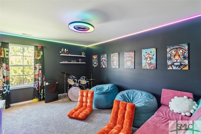 recreation room with carpet flooring and visible vents