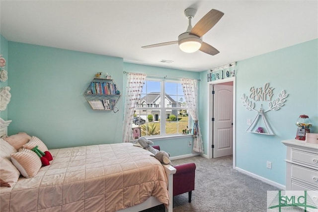 carpeted bedroom featuring baseboards and ceiling fan