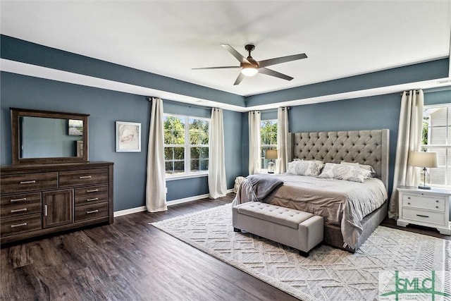bedroom with baseboards, a ceiling fan, and wood finished floors