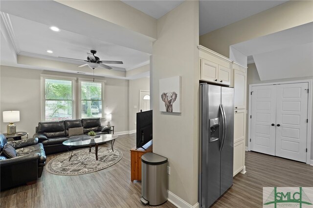 856 E 35th St, Savannah, GA 31401 - living room with ceiling fan, a raised ceiling, baseboards, and wood finished floors