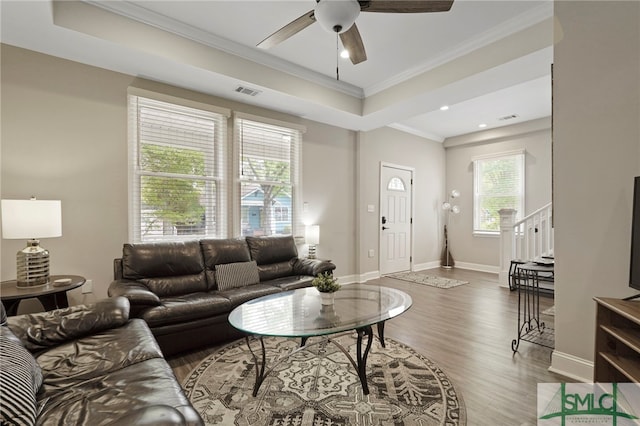 856 E 35th St, Savannah, GA 31401 - living room with wood finished floors, a ceiling fan, crown molding, visible vents, and a raised ceiling