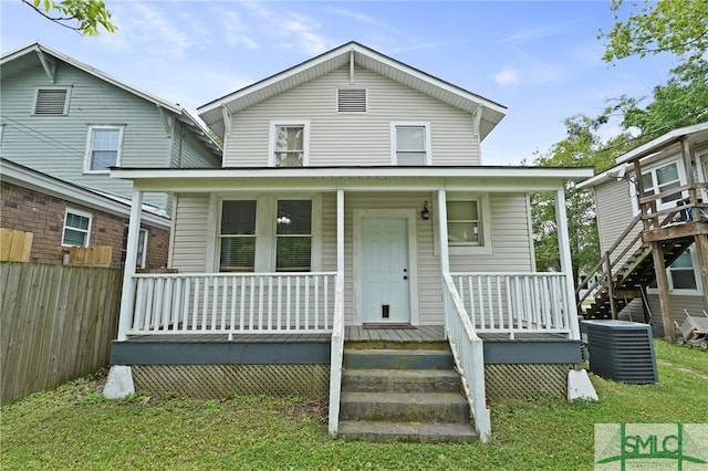 856 E 35th St, Savannah, GA 31401 - view of front of house with central AC, covered porch, and fence